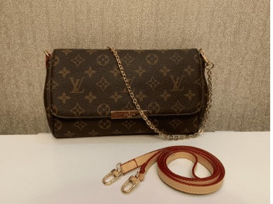 louis vuitton clutch review fake